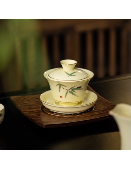Tea set with three-legged lid that can be suspended and rotated for brewing tea without burning your hands.
