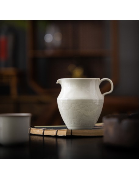 Handcrafted high-end ceramic tea infuser with engraved handle and ash decoration